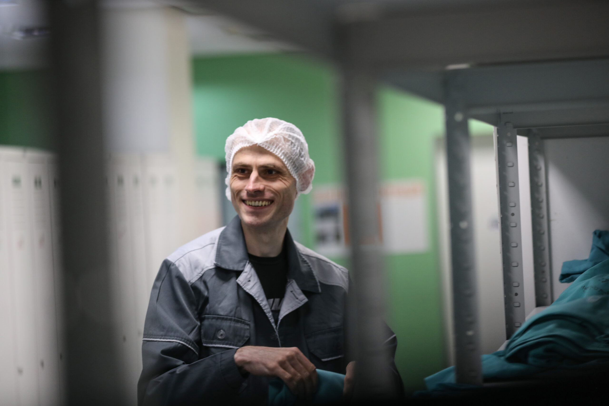 A smiling man in workwear